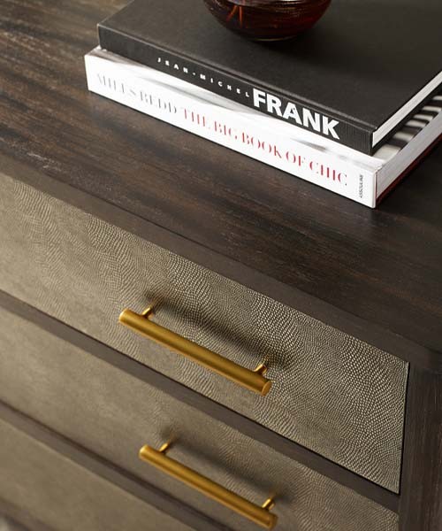 Close up detail of the TA Studio Norwood Chest of Drawers with dark brown shagreen leather drawers. 